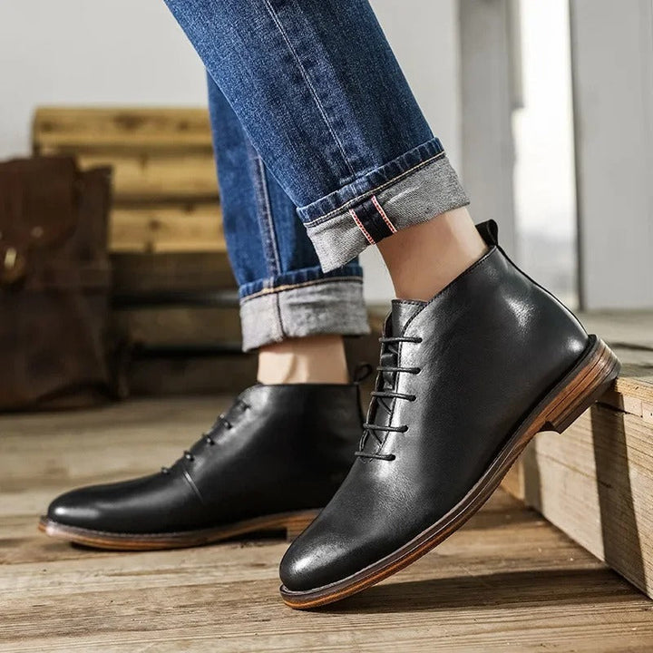 Men's formal Chelsea boots in rich dark brown leather, elastic side panels.