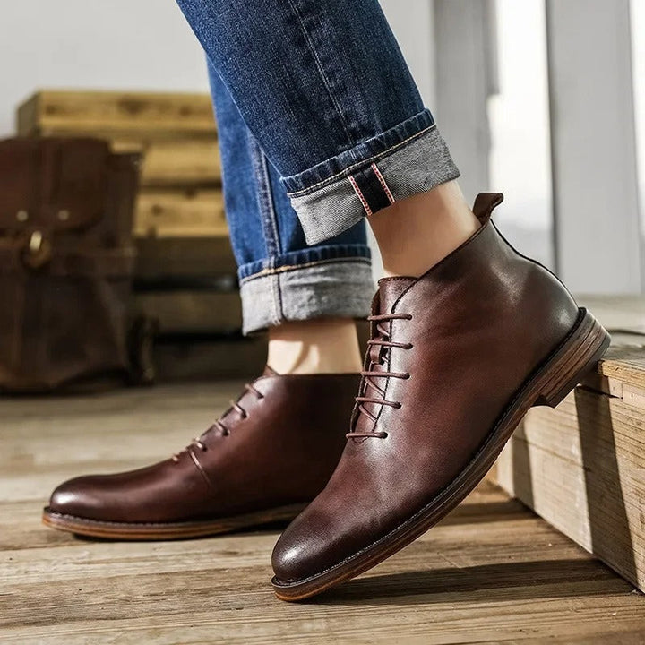 Pair of black men's dress boots, premium leather, elegant and versatile footwear.