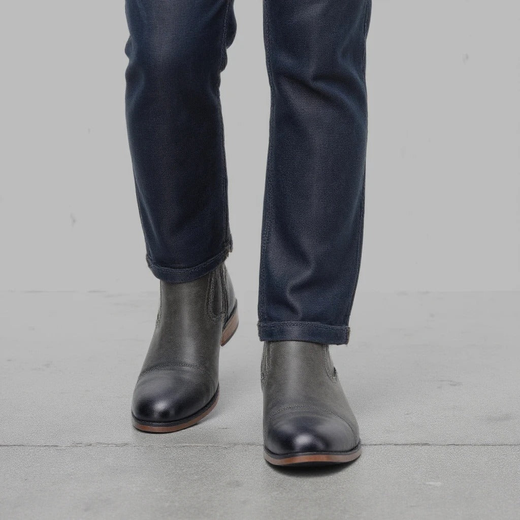 Detailed view of the leather texture on men's brown side-zip Chelsea boots, enhancing their premium feel.