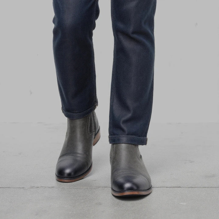 Detailed view of the leather texture on men's brown side-zip Chelsea boots, enhancing their premium feel.