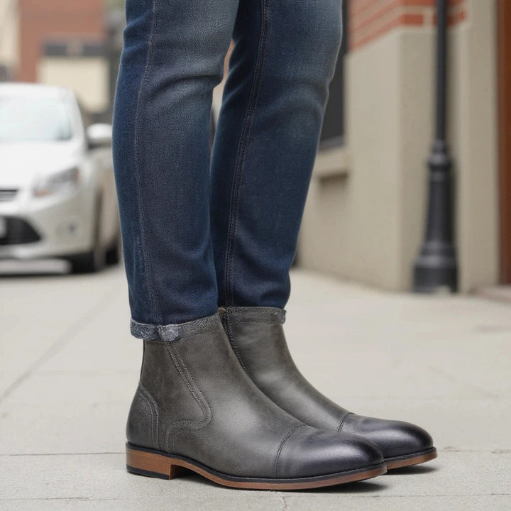Men's black dress boots, Chelsea style with side-zip, offering a polished look for professional settings.