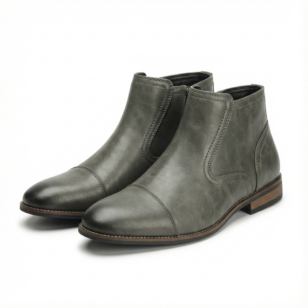 Back view of men's black side-zip Chelsea boots, highlighting the boot silhouette and sturdy construction.