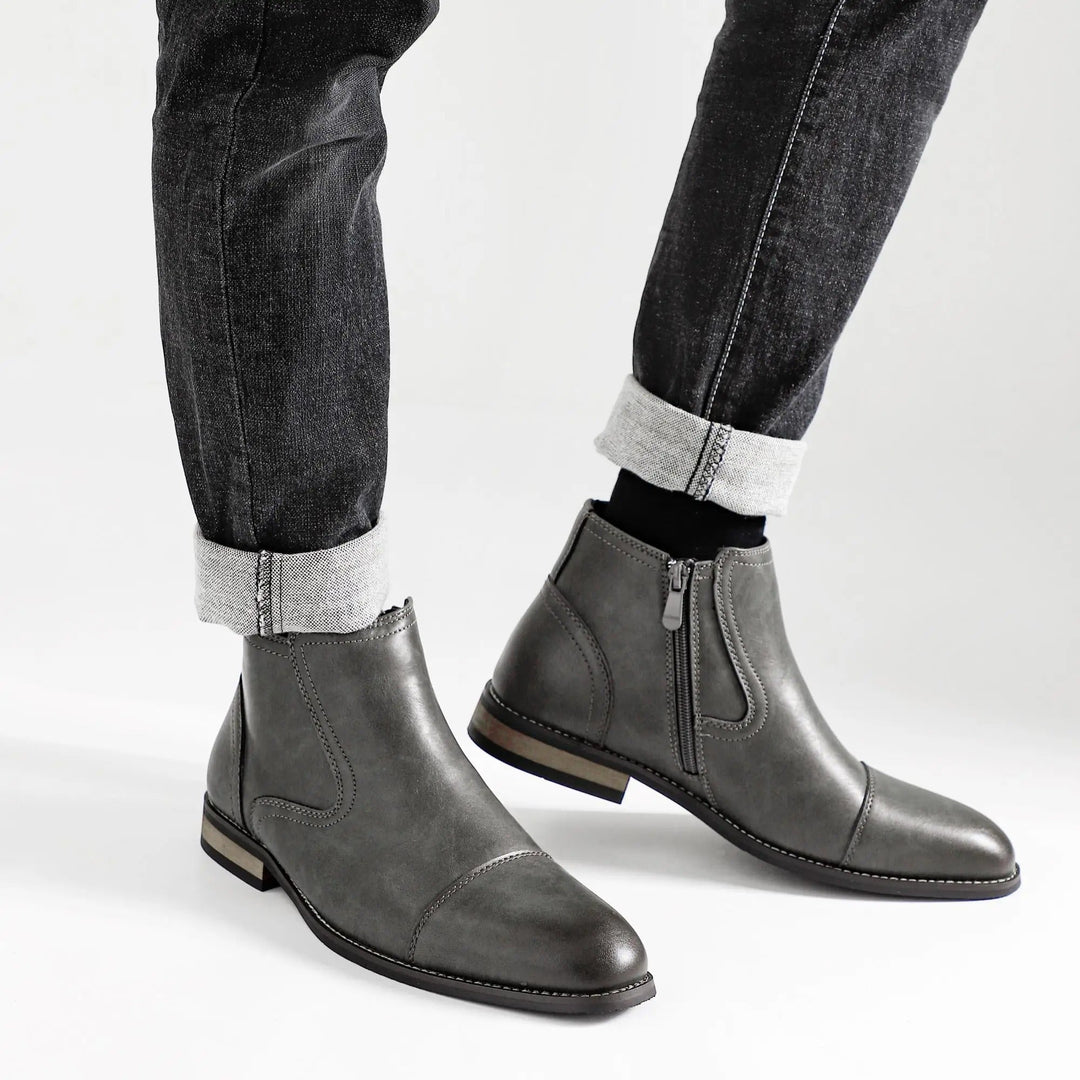 Top-down view of men's black side-zip Chelsea boots, showcasing their sleek design and quality craftsmanship.