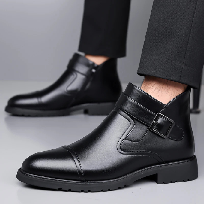Side profile of men's polished black Chelsea boots, a timeless choice for modern mens fashion.