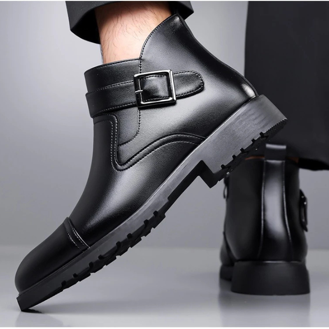Men's Chelsea style dress boots in genuine leather, showcasing elastic goring detail and sturdy sole.