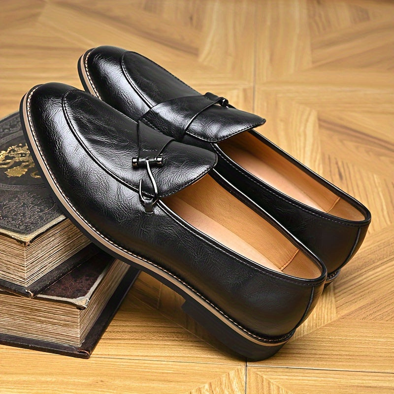 Pair of men's brown leather slip-on loafers, essential footwear for a sophisticated look