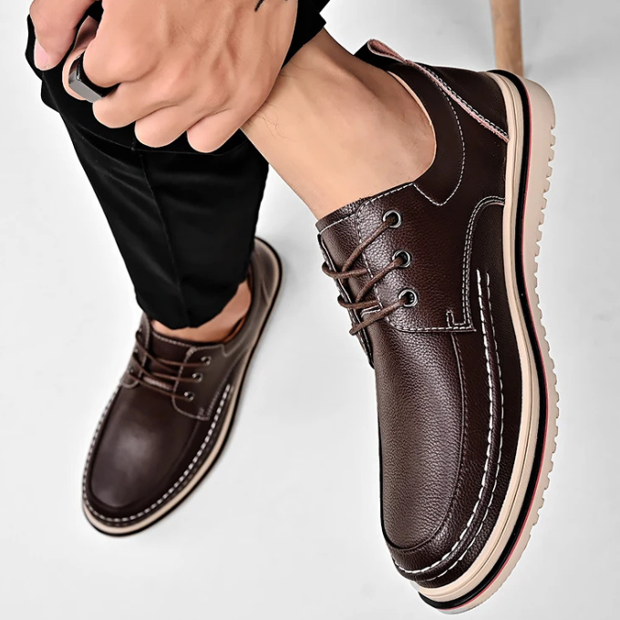 Men's dark brown moc-toe Derby shoes, showcasing their comfortable fit and formal appeal.