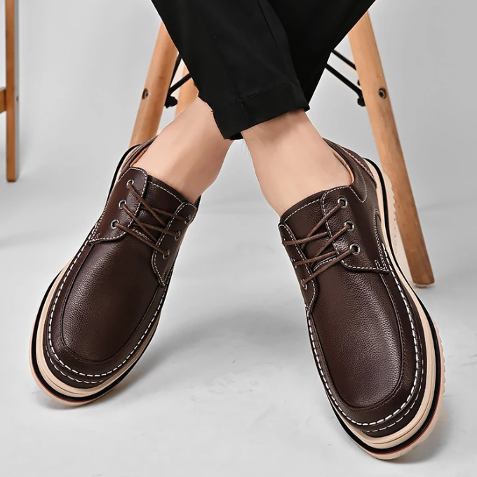 Full view of men's black leather moc-toe Derby shoes, ready for any casual or formal occasion.