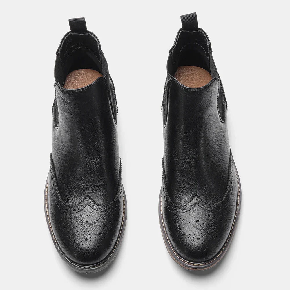 Men's footwear showcasing classic slip-on Chelsea boots in polished black leather, a fashion staple.