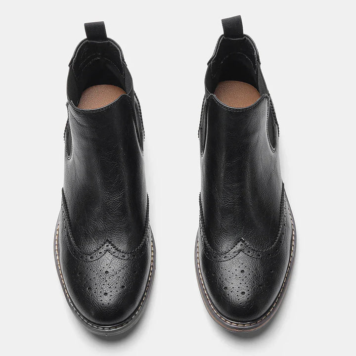 Men's footwear showcasing classic slip-on Chelsea boots in polished black leather, a fashion staple.