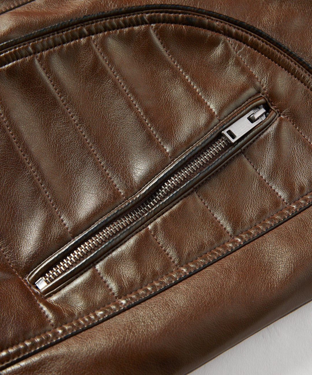 Side profile of a men's black PU leather jacket, showcasing moto style and quality material