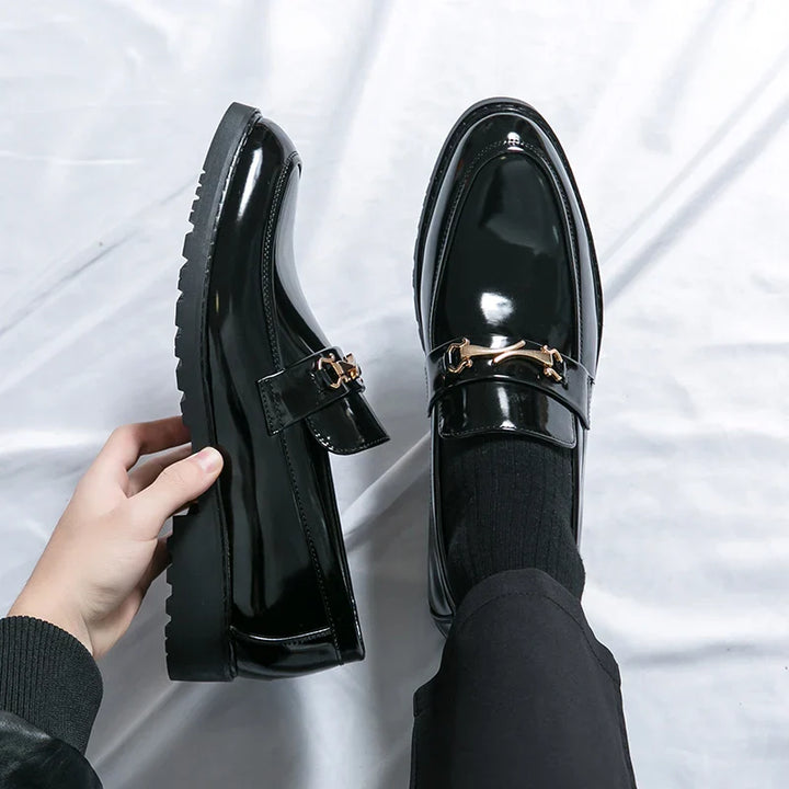 Close-up of a men's classic slip-on loafer in rich brown, showcasing the elegant leather texture.