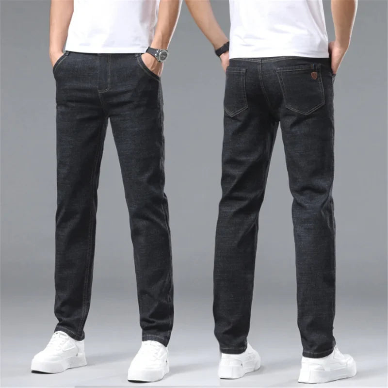 Close-up of a man wearing premium cotton denim jeans, showcasing structured fit and classic blue wash