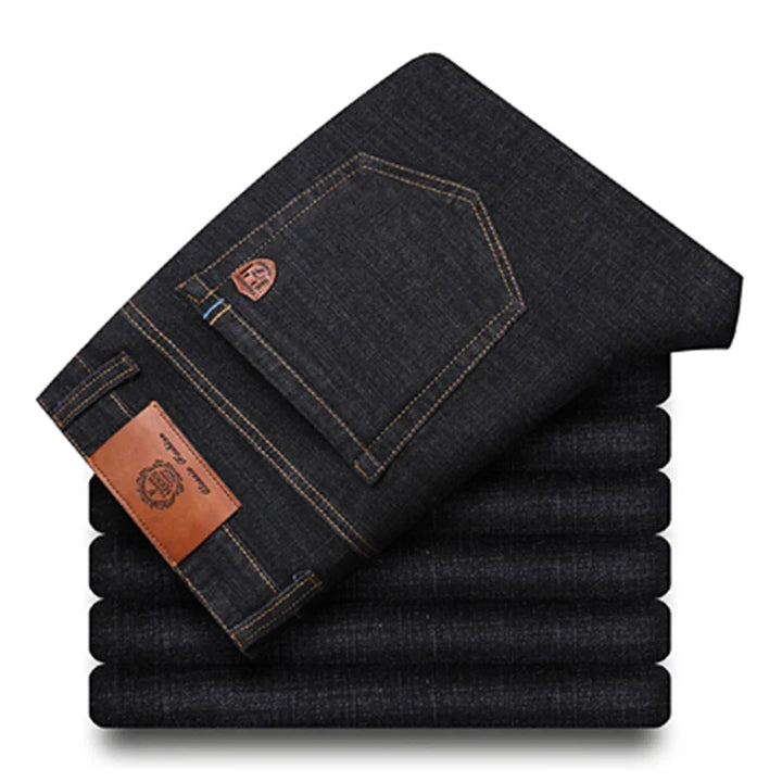 Back view of men's premium blue denim jeans, emphasizing structured fit and timeless design
