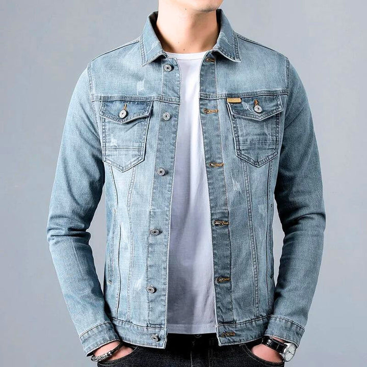 Close-up of a men's tapered denim jacket in blue, showcasing texture and stitching detail