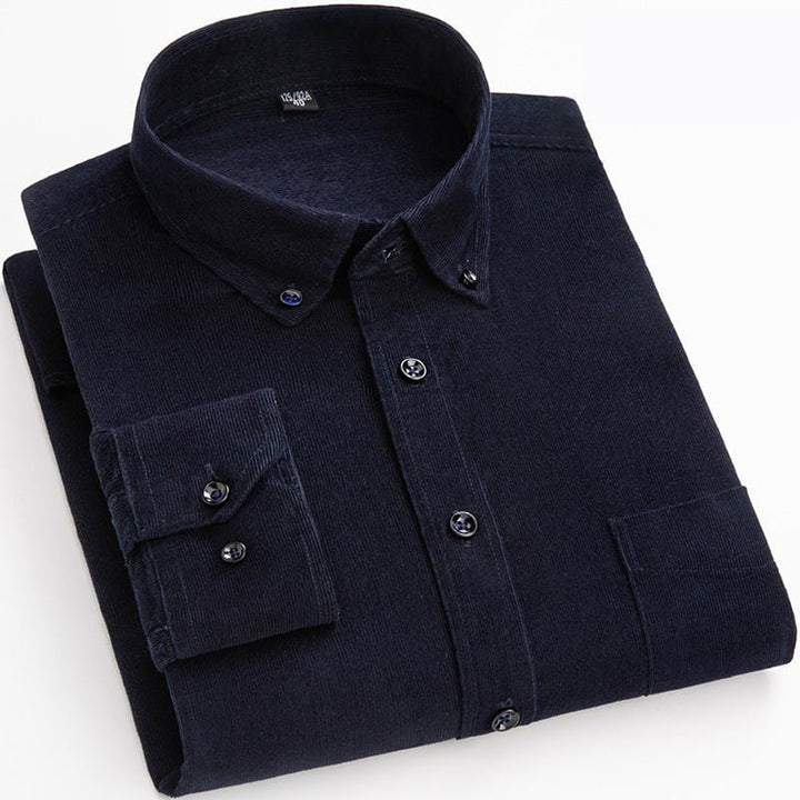 Close-up of a rugged men's corduroy button-up shirt in a rich, textured fabric