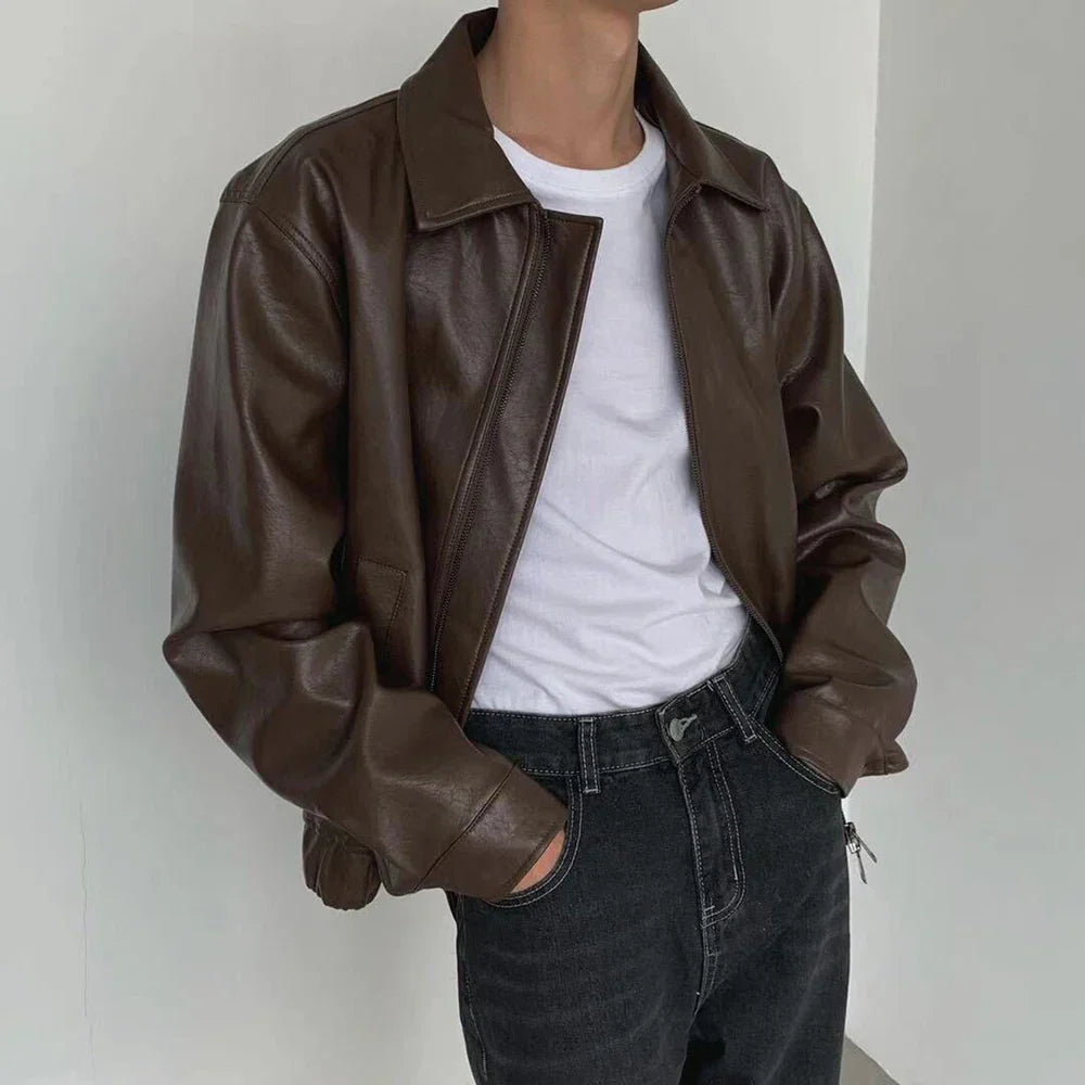 Black faux leather bomber jacket for men, detailed view of collar and zipper, perfect outerwear.