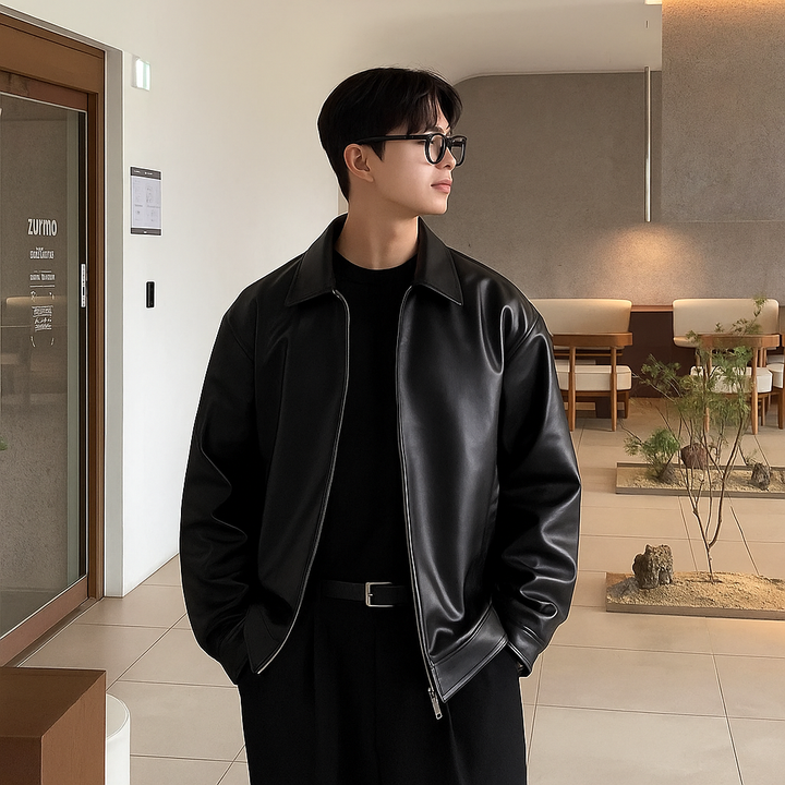 Man wearing a timeless brown faux leather bomber jacket, showcasing its casual fit and style