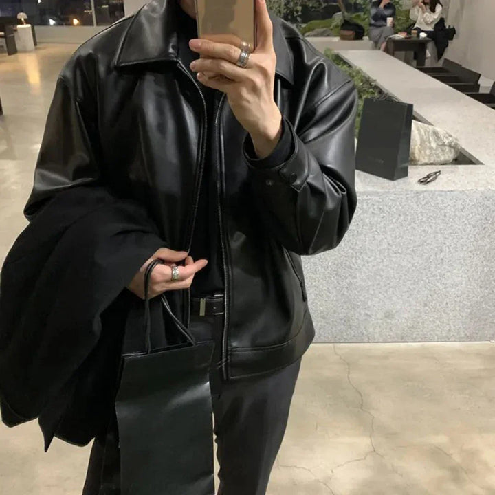 Close-up of a men's brown faux leather bomber jacket texture, ideal for everyday fashion.
