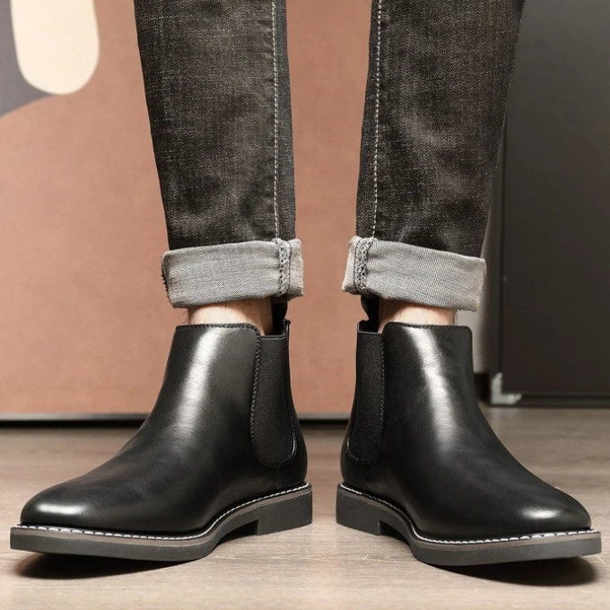 Men's classic brown leather Chelsea boots, perfect for formal or casual wear.