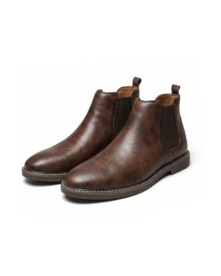Men's classic brown leather Chelsea boots, side view, showcasing elastic gore & pull tab.