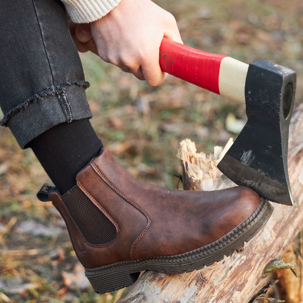 Men's sleek black leather Chelsea boots with polished finish, a timeless dress boot for sophisticated style.