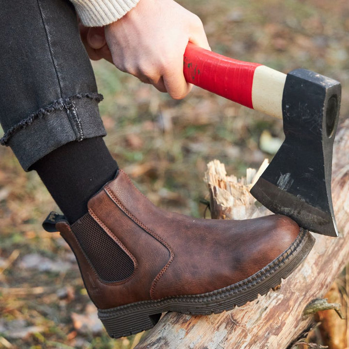 Men's sleek black leather Chelsea boots with polished finish, a timeless dress boot for sophisticated style.