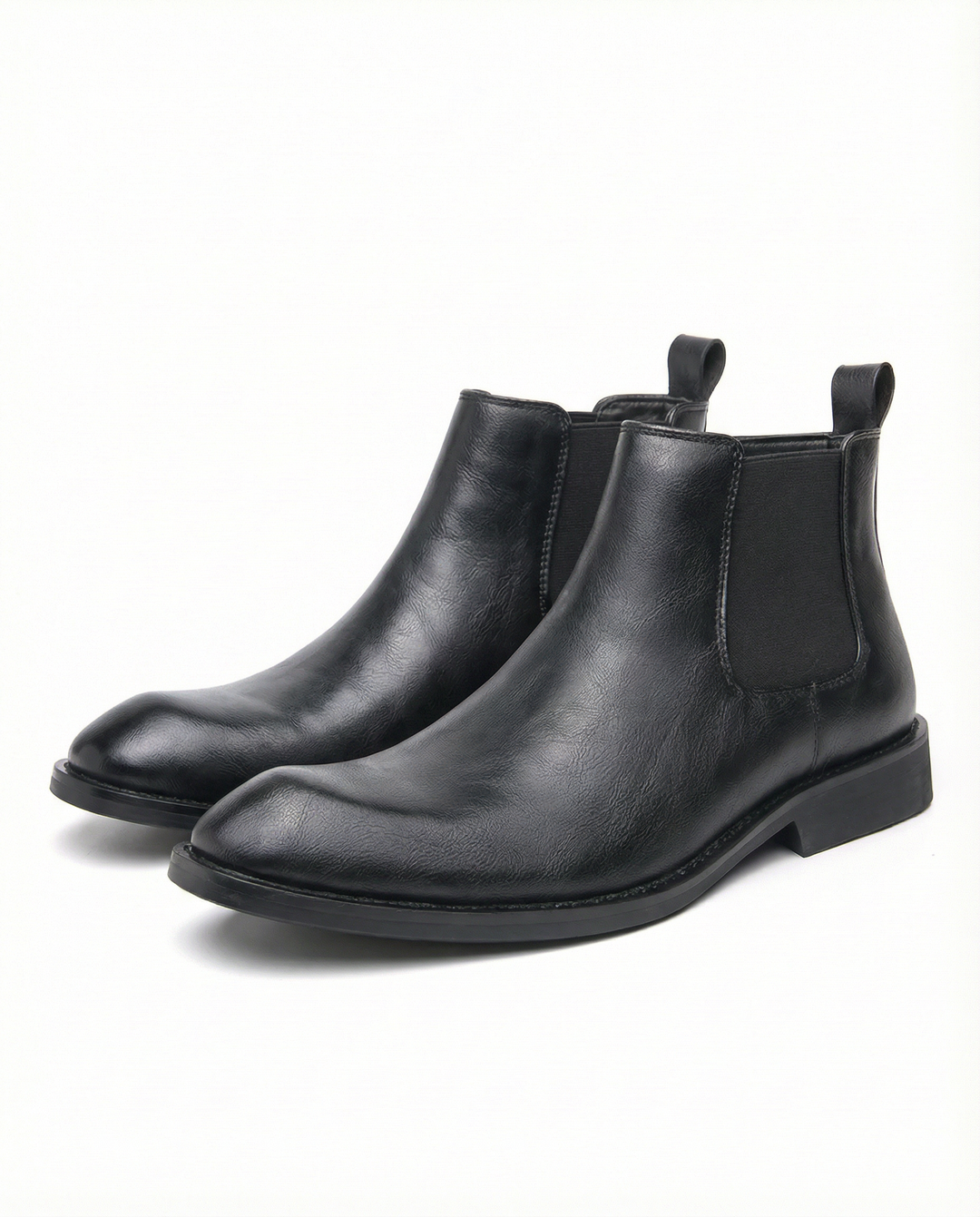 Detailed shot of the elastic side panel and sturdy pull tab on a men's classic leather Chelsea boot