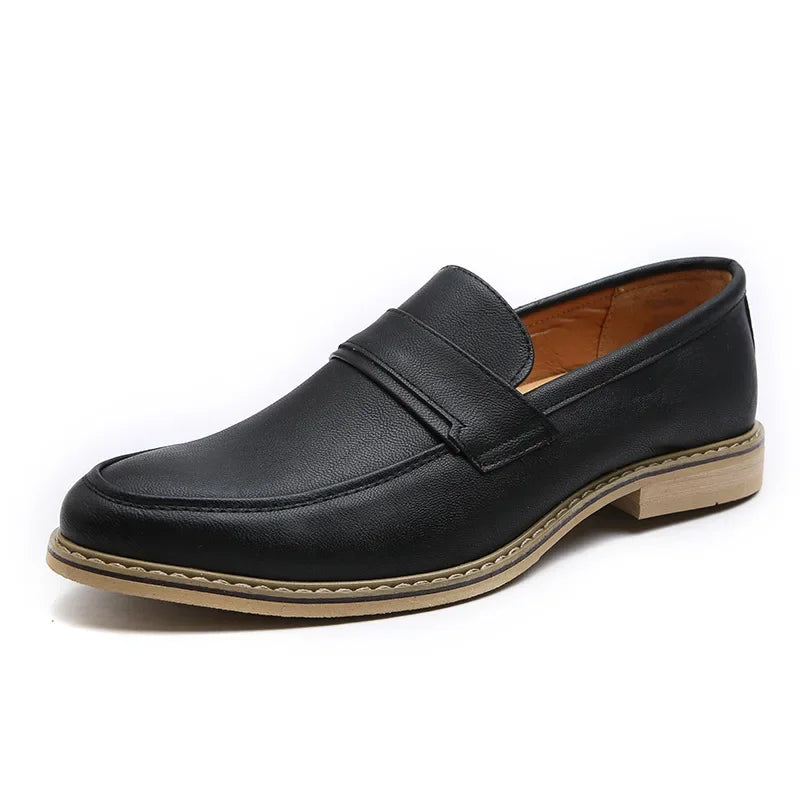 Side view of a men's classic leather loafer, slip-on formal shoe