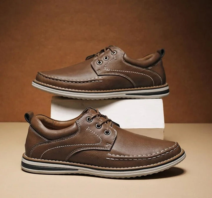 Men's elegant brown leather moc toe casual Oxford shoes, side profile