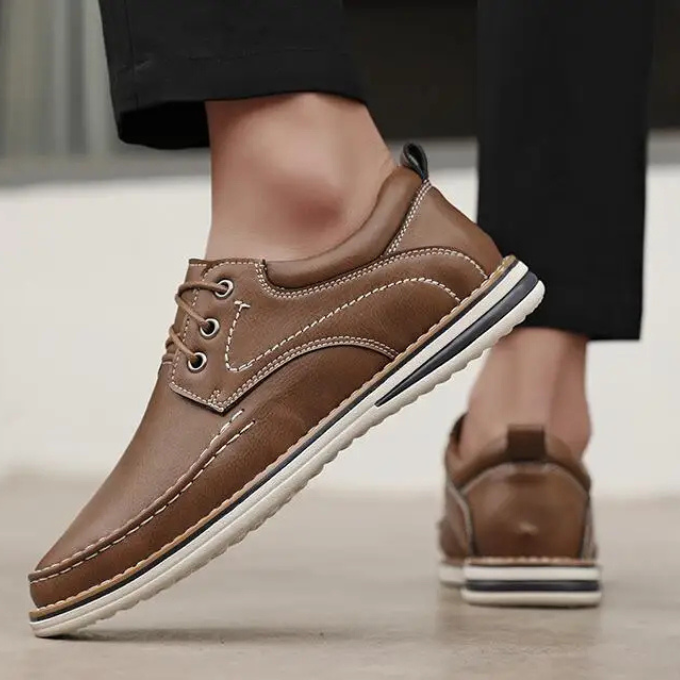 Front view of men's sleek brown leather moc toe Oxford shoes
