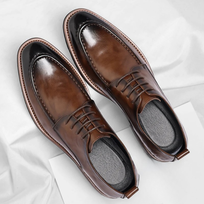 Black leather Oxford dress shoes for men, perfect for professional settings & sophisticated style.