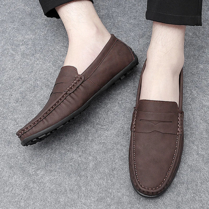 Men's sophisticated leather penny loafers, perfect for a sharp, refined look.