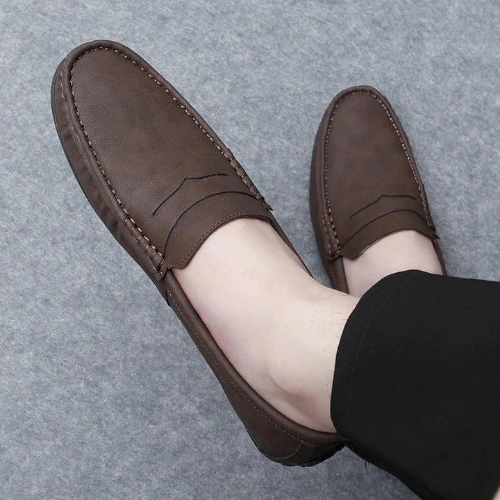 Fashionable men's leather penny loafers, blending tradition with modern trends.
