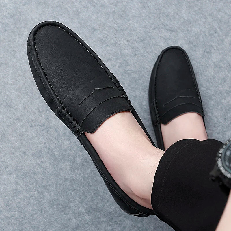 Men's smooth leather penny loafers, designed for a comfortable and snug fit.