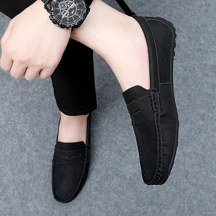 Men's robust leather penny loafers, crafted for both durability and aesthetic appeal.