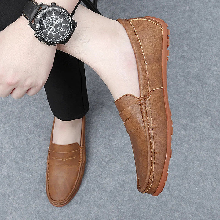 Front view of men's genuine leather penny loafers, a timeless footwear choice.