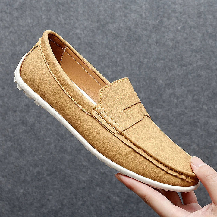 Men's casual brown leather penny loafers, offering both style and comfort.