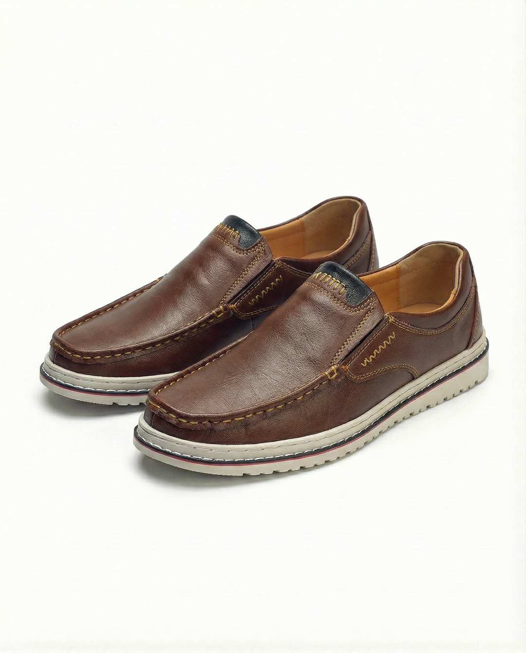 Men's classic brown leather slip-on loafers, hand-stitched for casual or dress wear, comfortable men's footwear.