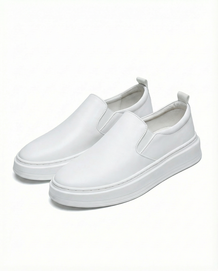 High-angle view of men's brown leather slip-on loafers, emphasizing their classic and functional appeal