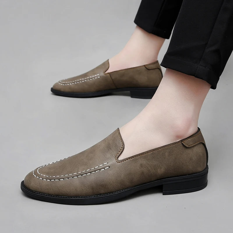 Hand-finished men's slip-on leather loafers, emphasizing craftsmanship and quality