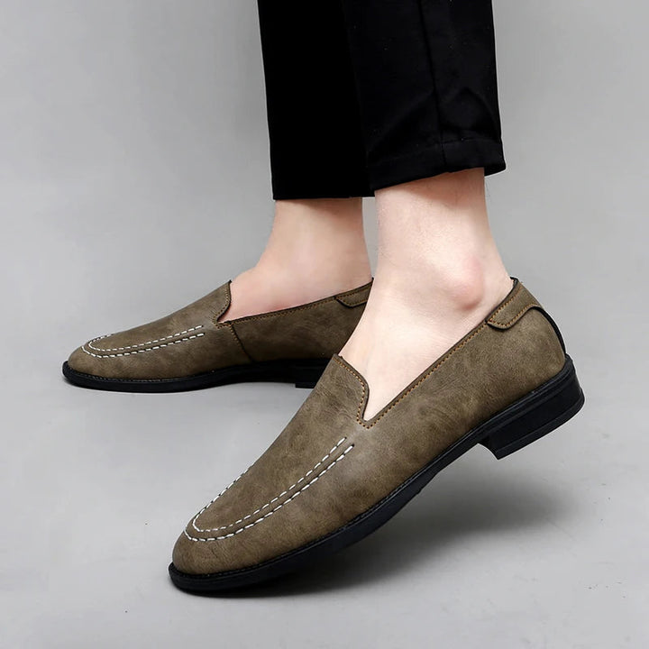 Front view of men's sophisticated black leather loafers, essential mens fashion