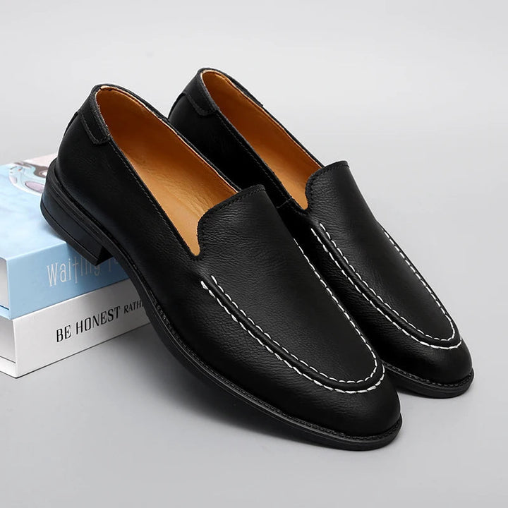 Close-up of premium black leather loafer for men, showcasing stitching detail