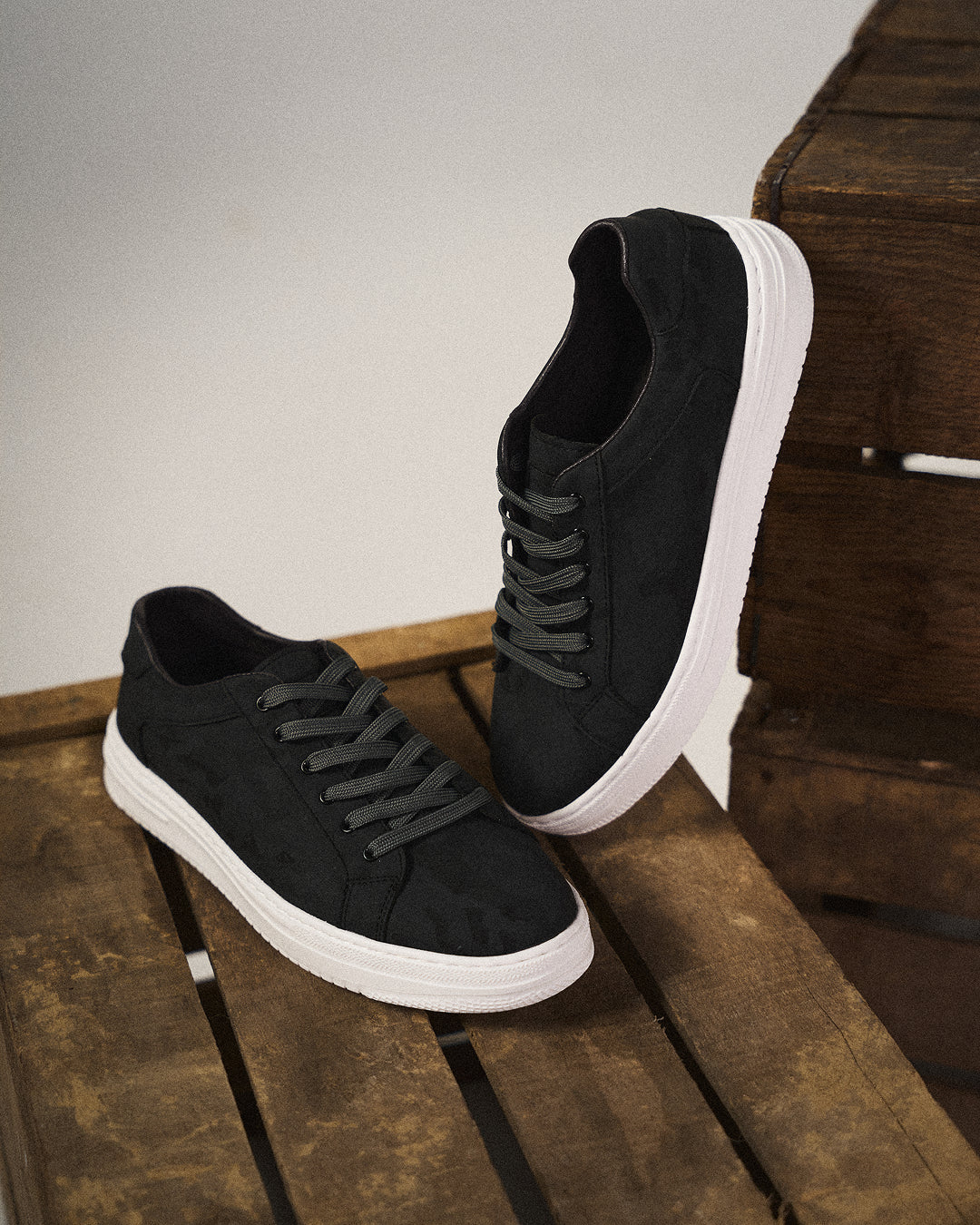 Side profile of men's everyday white leather sneakers, a clean and classic footwear choice.