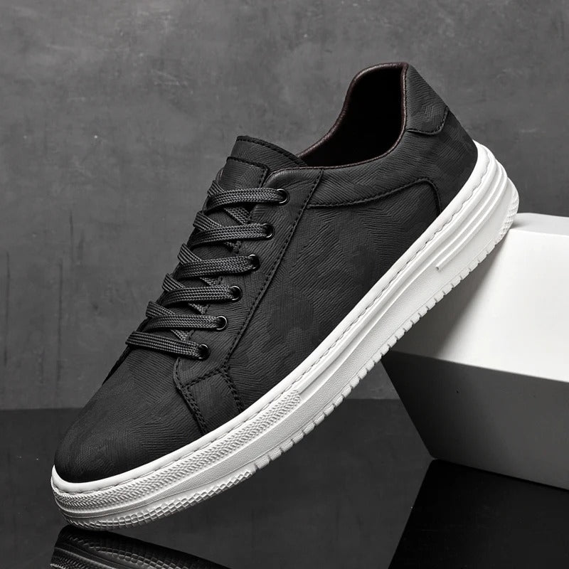 Detail of men's leather sneaker laces, indicating secure fit and classic footwear style.