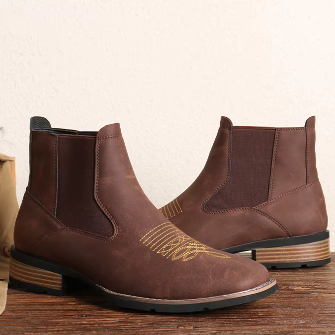 Top-down view of men's dark brown Western Chelsea boots, highlighting the sleek silhouette