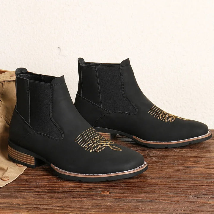 Side profile of a black Western Chelsea boot for men, showcasing the elastic gusset and pull tab