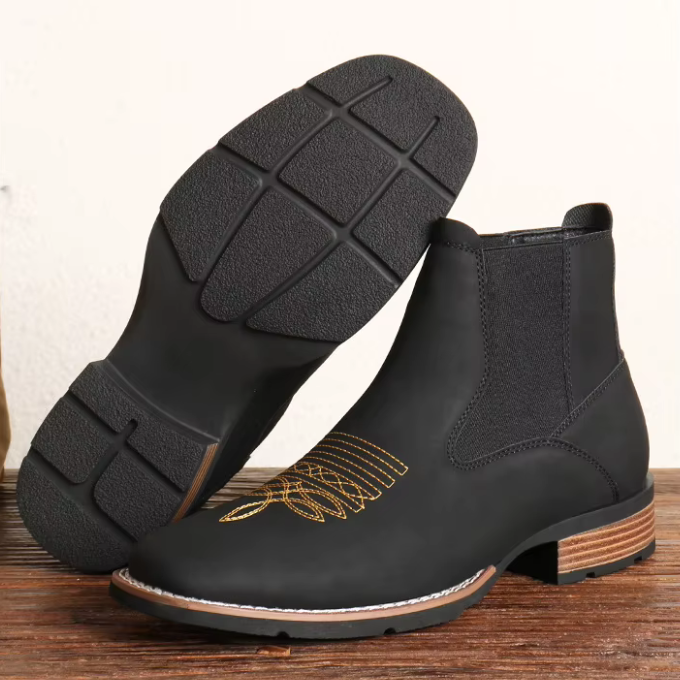 Casual men's black Chelsea boots with a subtle Western influence, ideal for versatile styling
