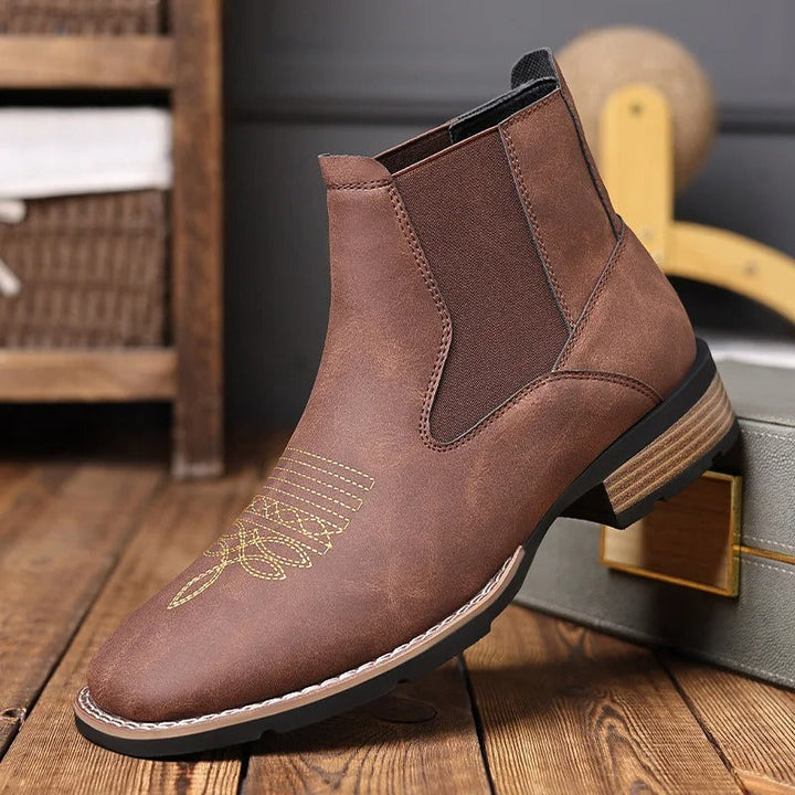 Pair of brown men's Western Chelsea boots, emphasizing the comfortable slip-on functionality