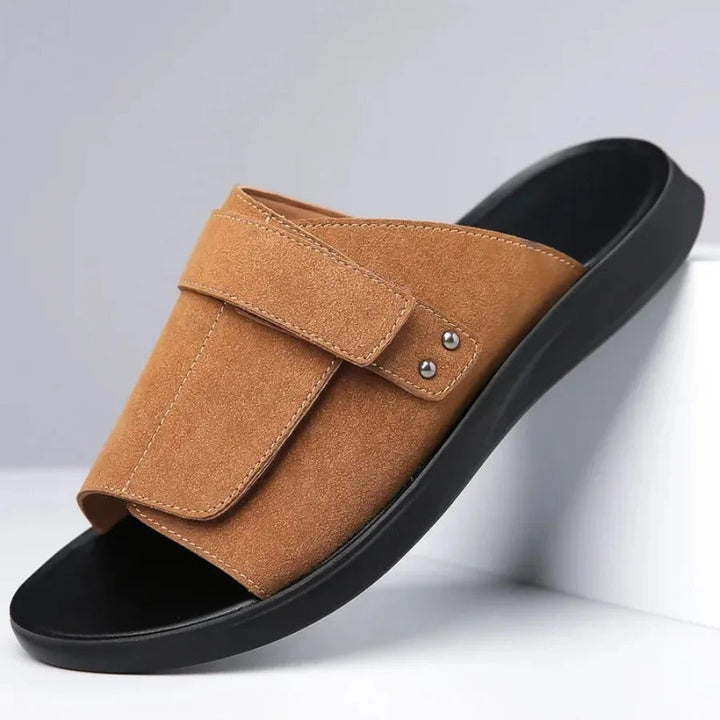 Close-up of men's suede sandals, highlighting the soft material and comfortable design.